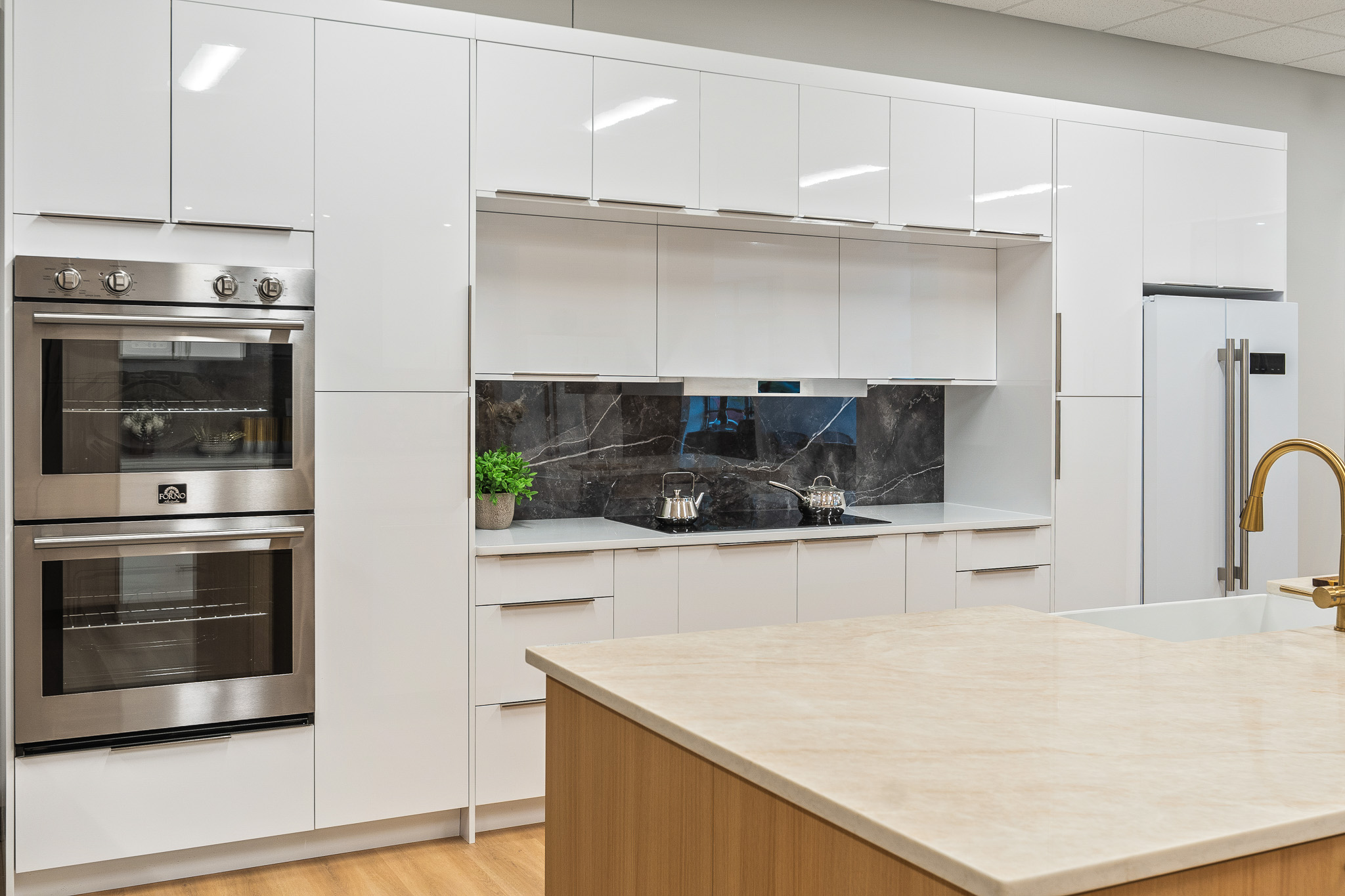 modern kitchen with sleek white cabinets